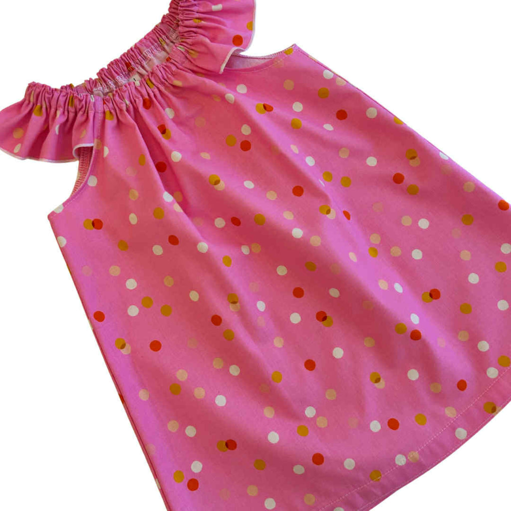 Pink dress with colorful polka dots
