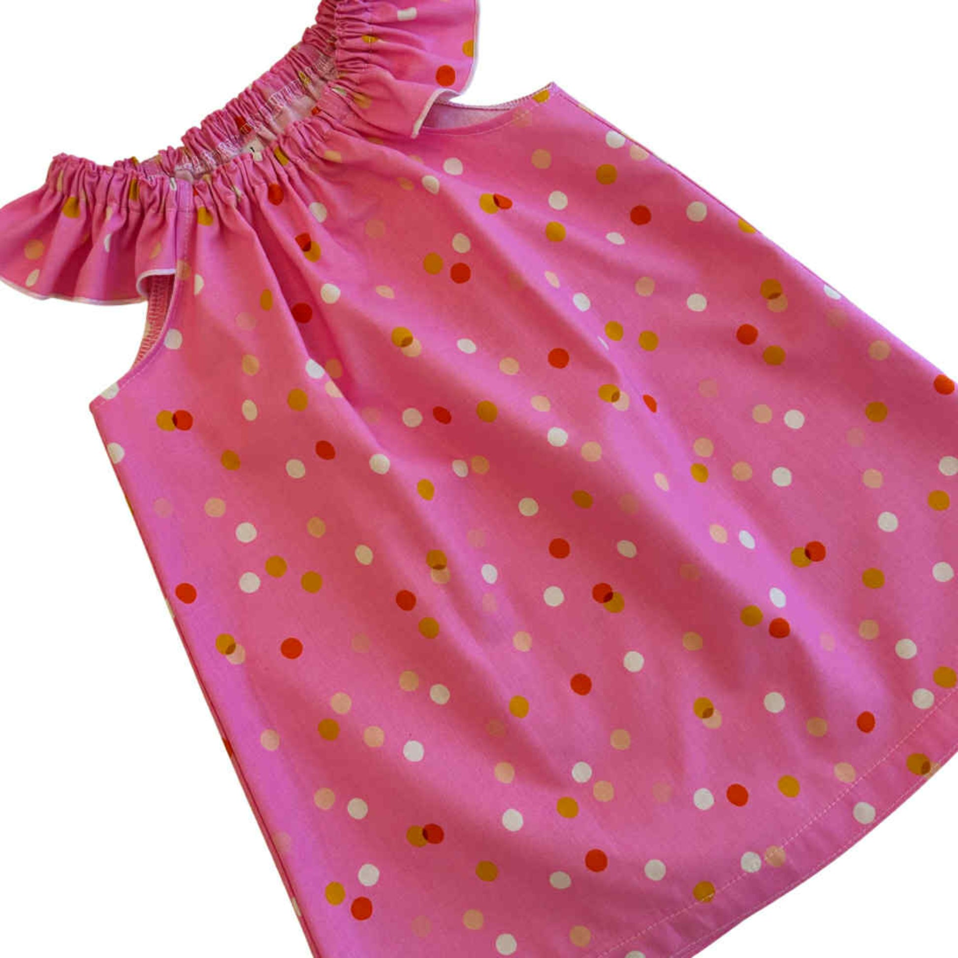 Pink dress with colorful polka dots