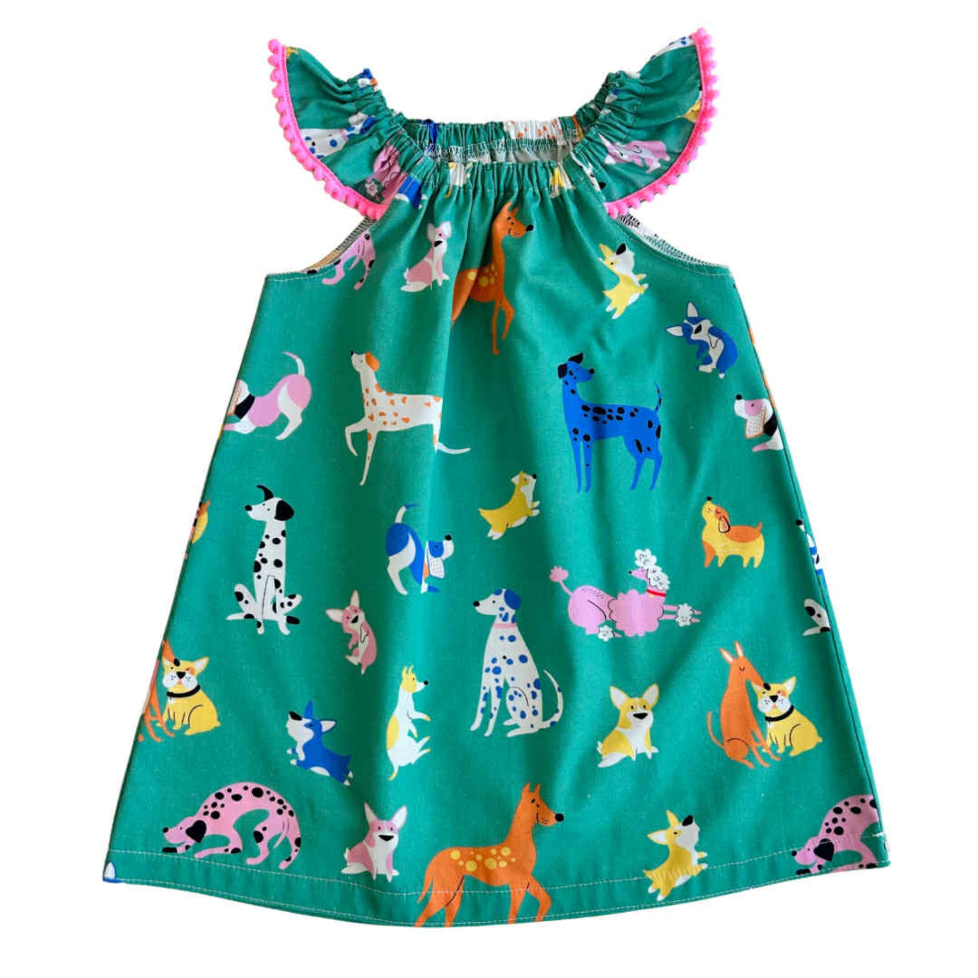 Green dress with colorful dog pattern 