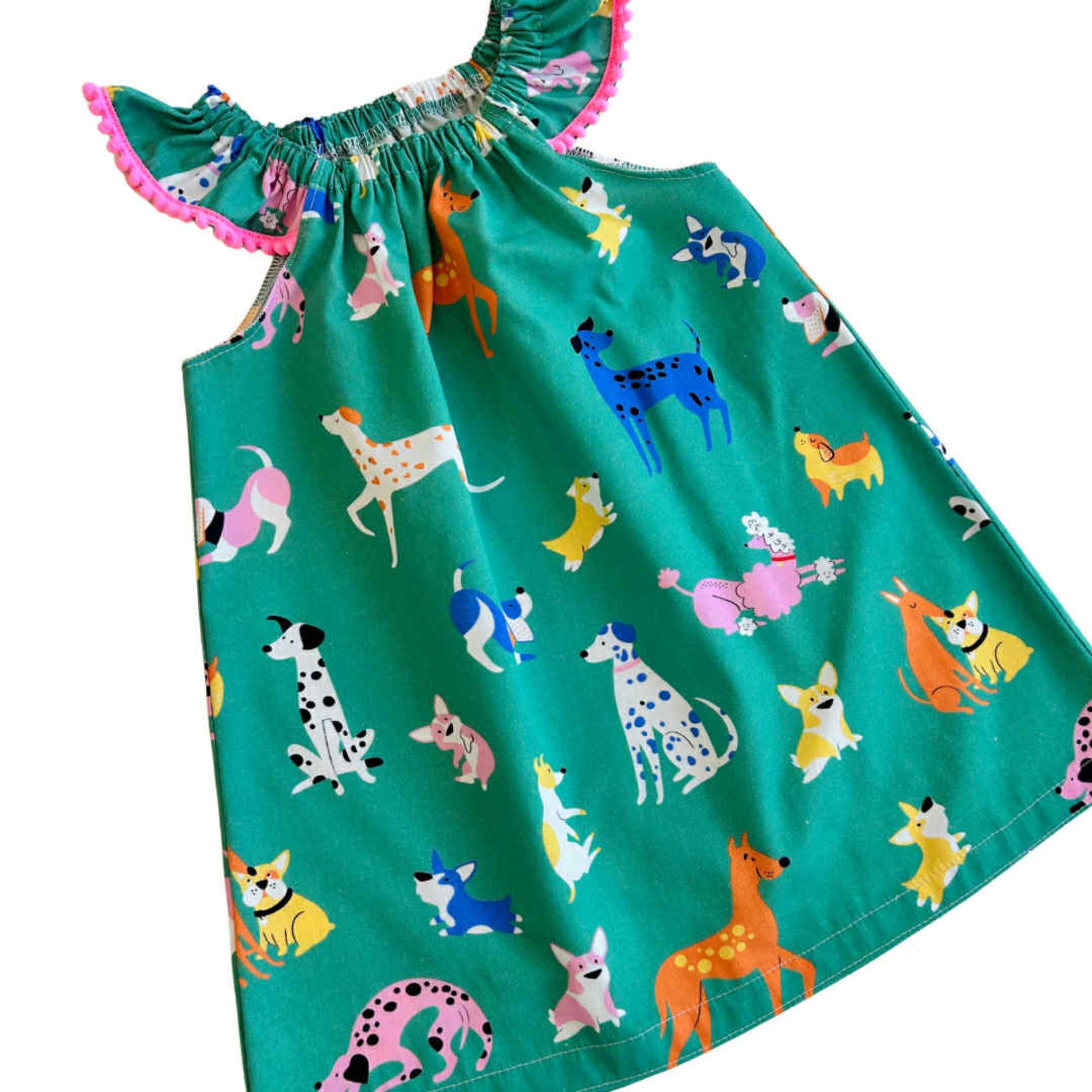 Green dress with colorful dog pattern 